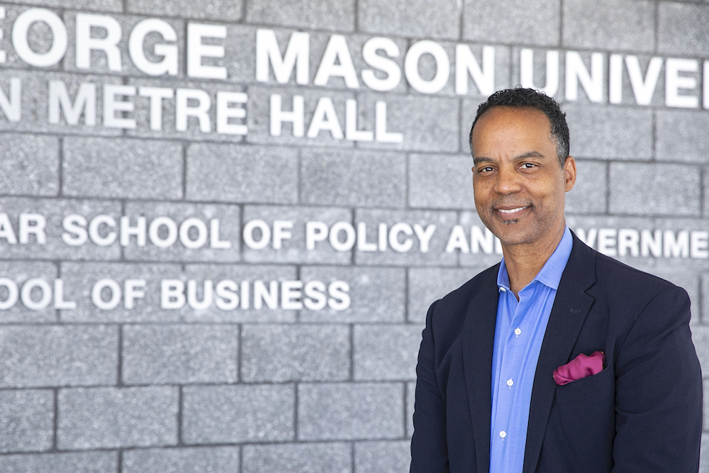 Michael Fauntroy standing in front of Van Metre Hall