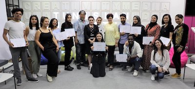 group of students holding certificates