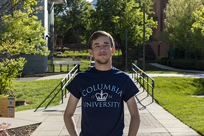Brad Byrne in front of the Johnson Center wearing a Columbia shirt