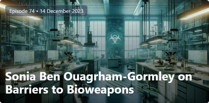 An image of a lab with a biohazard symbol on the back wall. The text, Episode 74 - December 14, 2023 appears on the top left. On the bottom is the text, Sonia Ben Ouagrham-Gormley on Barriers to Bioweapons.