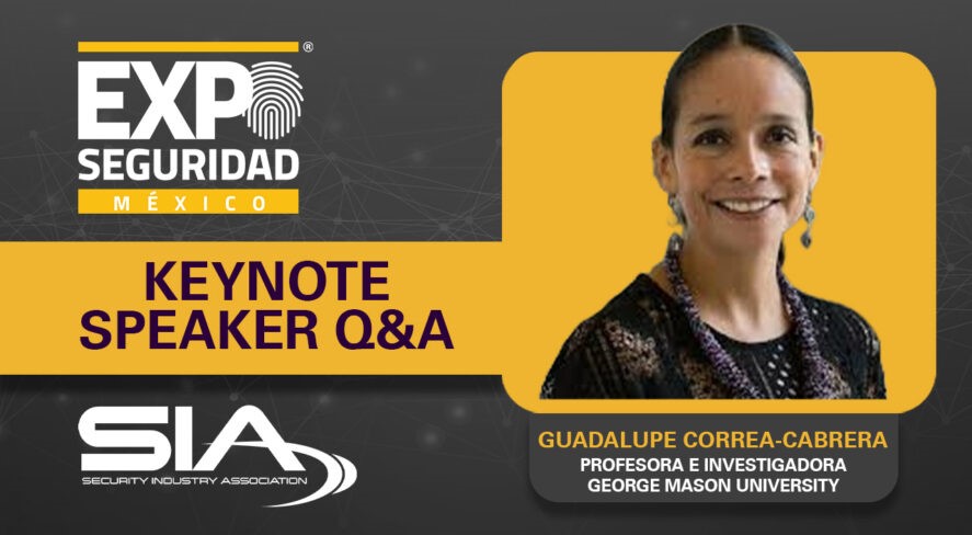 A woman with her hair pulled back smiles at the camera framed in a brown and gold advertisement.