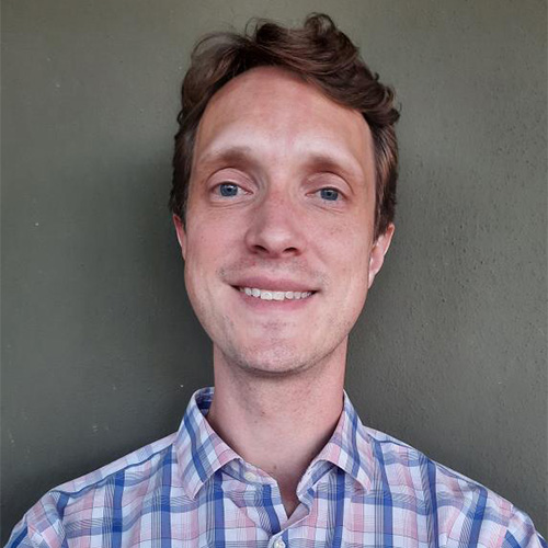 A headshot of assistant professor Daniel Worthington Smith