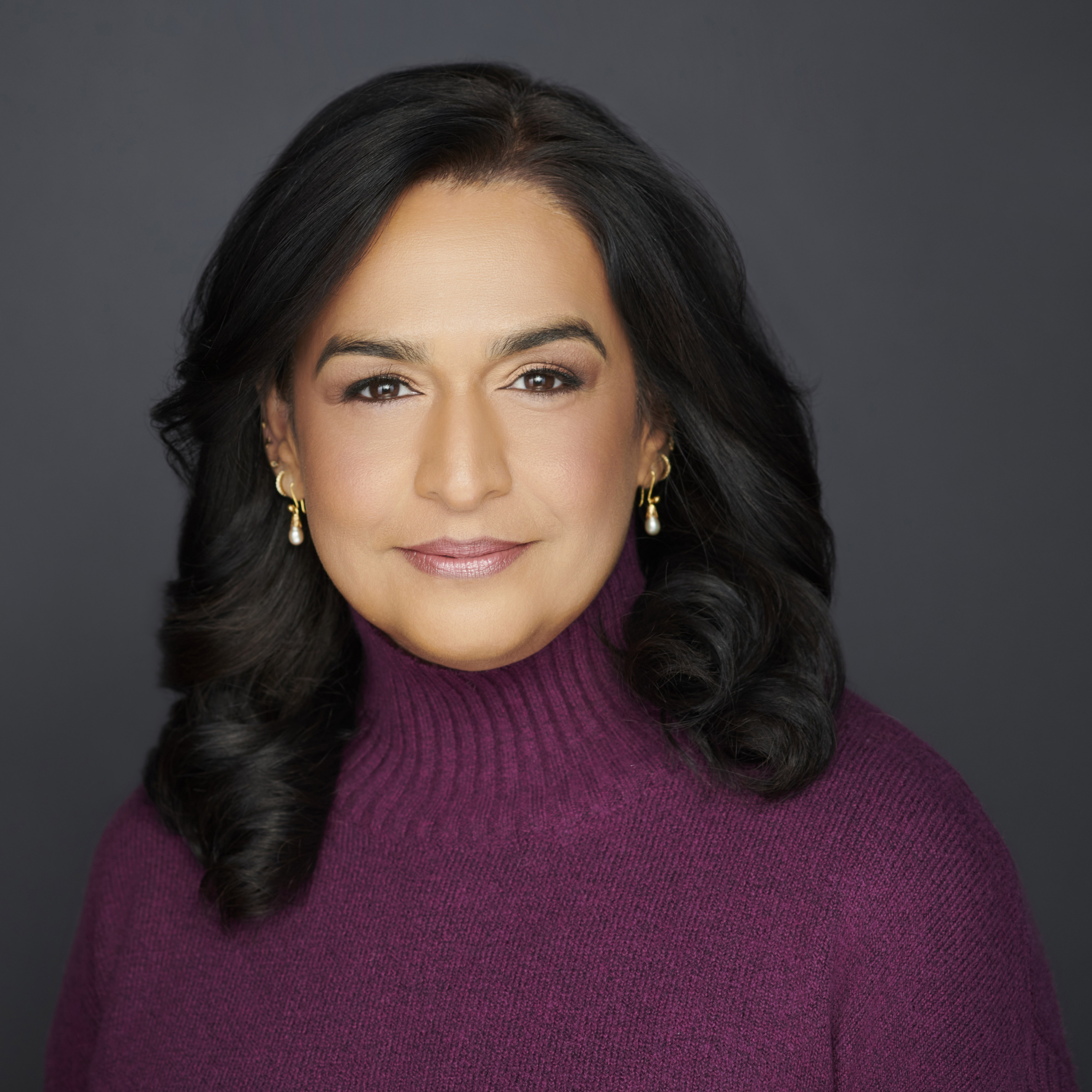 Headshot of Supriya Bailey in professional attire. 