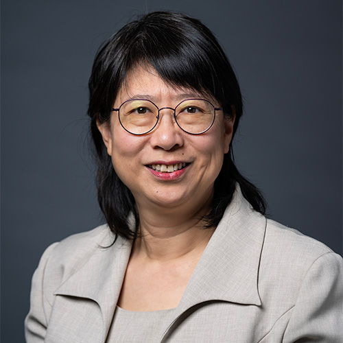 Bo Yu wears a gray skirt suit and glasses
