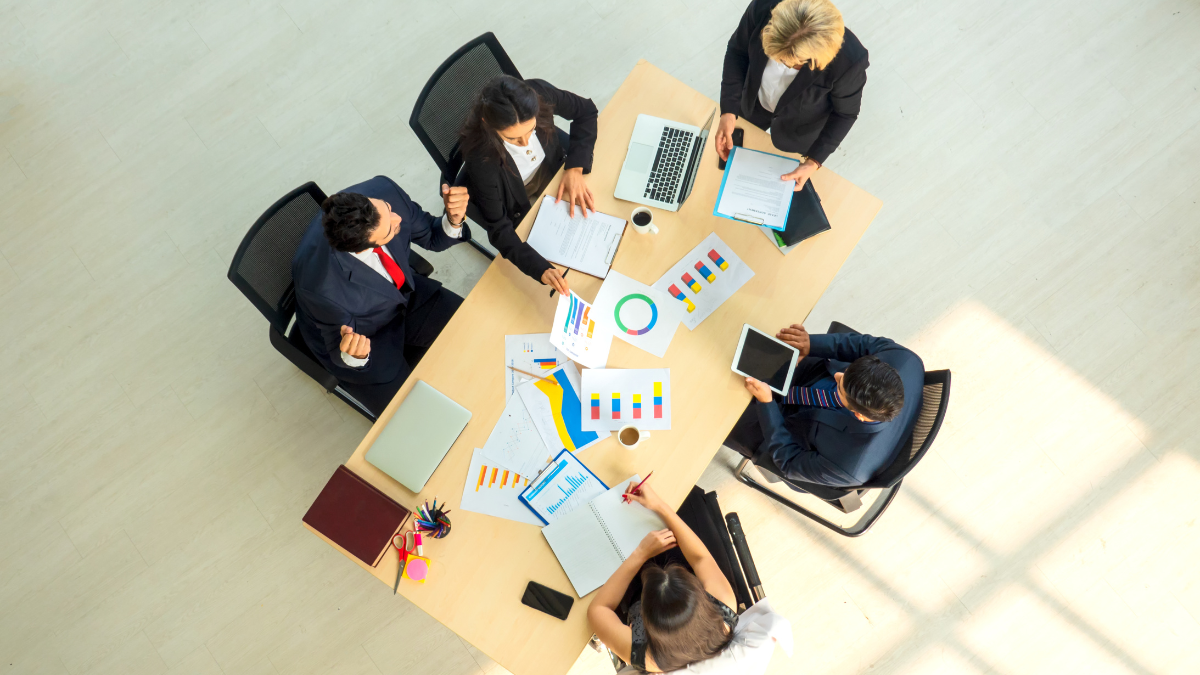 C-Suite executives gathered around a table