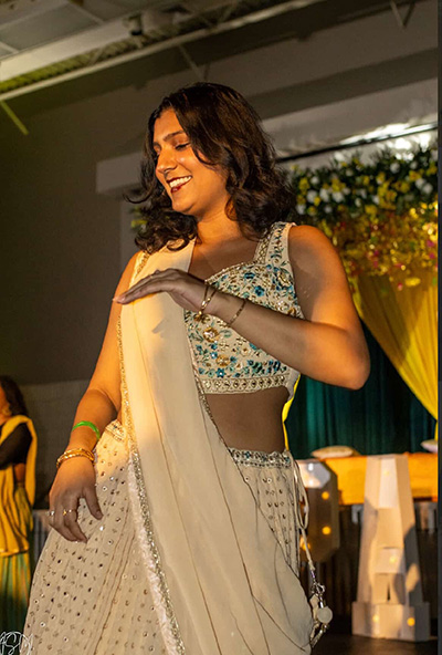 Marisa Parikh dancing in South Asian dress