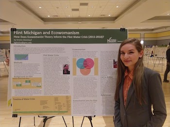 Kristin Gleichauf in front of her Honors 410 research poster