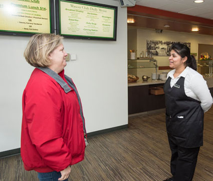 Catherine Wright is greeted at the Mason Club in the Pilot House.