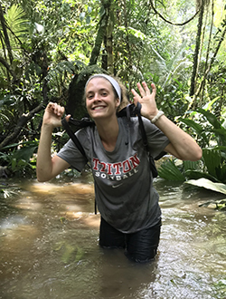 Katie Hogan standing in water in Peru