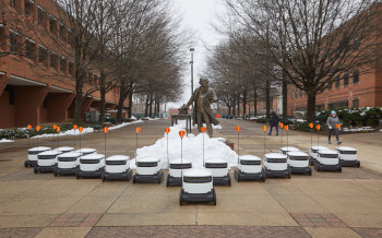 A fleet of starship delivery robots in a V-shaped formation