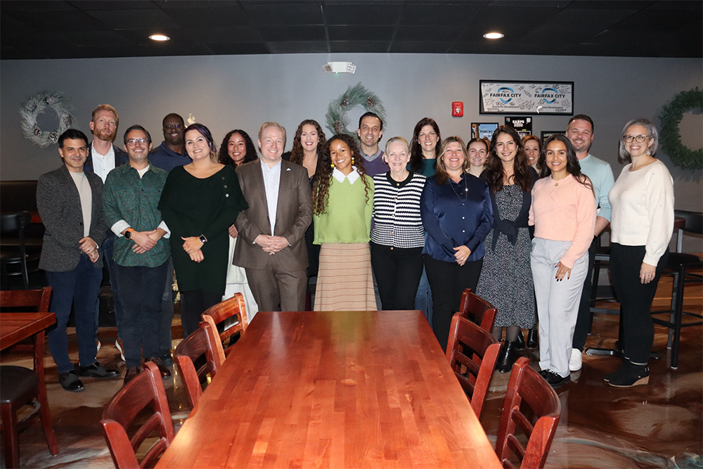 FCED staff pose together at a restaurant.