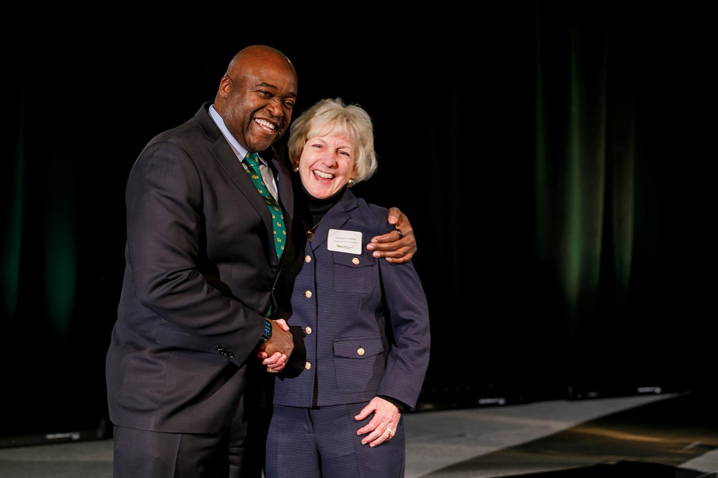 President Washington and Sharon Cullen on stage at Gold Day