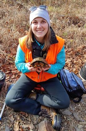 Jessica Meck holding an adult wood turtle. Photo provided.