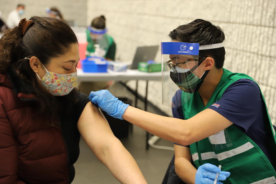 Taylor Paul gives COVID-19 vaccine