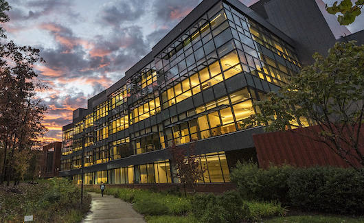 photo of a large building with lights on
