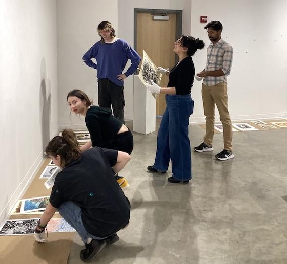 Students putting the exhibition up at the Gillespie Gallery in the Art and Design Building. Photo provided.