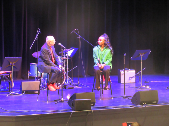 Professor Jim Carroll speaks to Carlehr Swanson during a pre-show question and answer session during her EP preview concert at George Mason in February 2024.