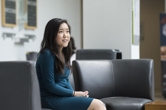 Stephanie Mui sitting on a couch