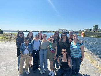Students standing in front of water