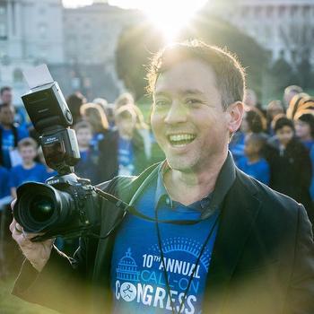 Evan Cantwell holds his camera at a Fight Colorectal Cancer event in Washington, D.C.
