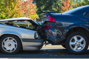 Two cars that have been involved in a rear-end collision